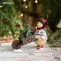 Charming resin snowman figurine pushing a rustic cart with a miniature Xmas tree - Pushcart Girl Ornament