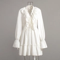 Detail of white V-neck dress featuring tiered ruffles and bell sleeves for a romantic look - S / White