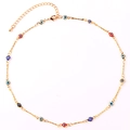 Detailed view of gold-plated necklace with colorful evil eye charms and lobster clasp - Multicolor Necklace