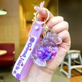 Purple candy-shaped liquid keychain with Good Luck strap and golden metal ring - Lollipop String [purple] Glow-in-the-dark Bubble Bead Candy