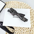 Elegant black bow hair clip with luxury crystals and metallic spring fastener - Mineral Grey Rhinestone - Flat Corner