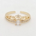 Macro view of gold crown ring featuring an oval center zircon and small side diamonds - Adjustable Open / Gold