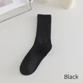 Classic black ribbed cotton crew socks for women featuring minimalist学院风 styling - Black