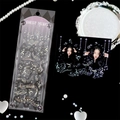 Macro view of holographic sheet music stickers with music notes and silver foil accents - Star Score
