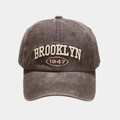 Close-up of vintage washed grey baseball cap with 3D Brooklyn 1947 embroidery details - Adjustable / Brown