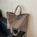 Minimalist canvas tote bag in taupe with adjustable wide strap for commuting - Coffee