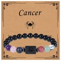 Macro del bracciale zodiaco Cancro in pietre naturali con simbolo inciso su carta - Cancro (Cancer)