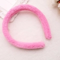 Detailed view of a soft pink plush headband on a white aesthetic background - Deep Pink (Faux Rabbit Fur)