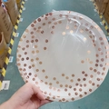 White disposable paper plates featuring rose gold foil polka dots in plastic packaging - Rose Gold Dots 9-inch Plate x24