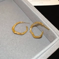 Minimalist gold oval hoop earrings with irregular wave texture in a jewelry box - Gold Wave Texture Hoop Style (60#)