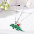 Detail of green glitter dinosaur pendant with gift box on silver necklace chain - Dark Green Dinosaur with Gift - Silver Chain