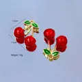 Detail view of cherry pendants with dimensions 1.5cm by 1.1cm and weight 1.8g each - Cherry