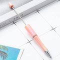 DIY beadable ballpoint pen in peach pink pearl finish with metallic silver accents - Macaron Rouge Pink Gradient
