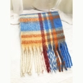 Close-up of soft blue and orange checkered scarf with long tassels on white cloth - Yellow Blue