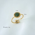 Detail of adjustable gold ring with green natural stone, featuring size and weight markings - African Jade
