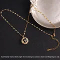 Golden titanium steel spinning clover necklace with black zircon petals and crystals - Black Gold Camellia Style Rotating (A839)