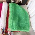 Ethnic style winter plush hats with colorful tassels in green, white, and red variants - Emerald