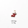 Detail of a red enamel Christmas stocking charm with gold stars and dimensions 13x17mm - No.27 Star Red Sock