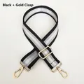 Detail of adjustable black and silver striped nylon bag strap with gold metal hooks - Black + Gold Hook