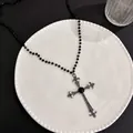 Detail of gothic black beaded necklace with ornate cross pendant and central gemstone - Black Bead Chain Large Gemstone Cross / Black