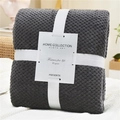 Dark gray waffle knit flannel blanket folded with elegant white gift ribbon and card - Black and Gray