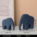 Set of two navy blue minimalist wooden elephant statues in small and large sizes - Elephant Blue Pair
