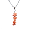 Vertical row of irregular orange agate raw stones on a polished silver chain necklace - Agate