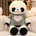 Large plush panda doll wearing a grey LOVE heart sweater on a soft white sofa - Midnight Black