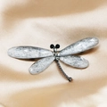 Silver dragonfly brooch with gray fiber-textured wings and sparkling rhinestones - Grey/White