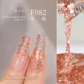 Plant-based gel nail polish in Sunset Clouds F082 with warm orange-pink glitters - F082 Sunset Glow