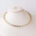 Close-up of elegant gold tennis necklace with round clear crystals on a white mannequin - Round Zirconia Style A / Gold