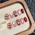 Handmade Chinese lion dance press-on nails in red and pink with 3D embossed art - Extra Small (XS)