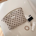 Detailed top view of polka dot corduroy makeup bag with metal zipper and fabric label - Beige Dot