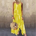 Detail view of yellow tie-dye maxi dress with irregular slit hem and summer straw bag - S / Yellow
