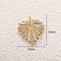Macro shot of gold leaf pendant with rhinestones and size details 23mm by 20mm - Gold Leaf with Zirconia