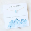 Aquamarine water drop pendant necklace with fine gold chain on minimalist marble background - Aquamarine