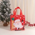 Christmas non-woven gift bag with Santa Claus print on a snowy wooden table - Waving Santa Style (5006-2) / 36*32*12