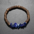 Bohemian bracelet featuring dark wood beads with blue natural stones and gold accents - Lapis Lazuli