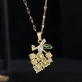 Elegant gold titanium steel grape necklace with yellow crystals and green leaf detail - 9069 Gold Grape