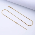 Detail view of a gold-colored stainless steel snake chain with lobster clasp and extender - 40+5cm / 1.2mm Square Snake Chain / Gold