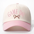 Close-up of pink GAME DAY embroidery and bow detail on a cotton baseball cap - Adjustable / Off-white and Pink