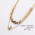 Double-layered gold chain necklace with bone-shaped links and a polished heart pendant - Gold