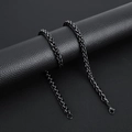 Detailed view of black stainless steel keel chain with lobster clasp on leather texture - 3.0mm*50cm / Black