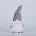 Detailed view of Christmas gnome plush with grey sequin hat and white faux fur beard - Gray