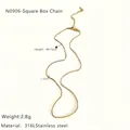 Detail view of 1.3mm wide gold 316L stainless steel box chain necklace with 40+5cm length - Gold Box Chain
