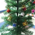Close-up of colorful miniature drum ornaments hanging on green Christmas tree branches - 12Pcs Colorful Small Drum Christmas Ornaments