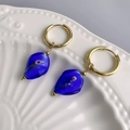 Detail of 18K gold hoop earrings with blue glass drop pendants and purple rose inlay - Gold-Blue