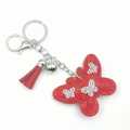 Sparkling red butterfly keychain with rhinestones and a red tassel on silver hardware - Red