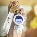 Luminous astronaut cat keychain with white strap and golden 'Be! HAPPY' text detail - Glow Astronaut - String Silver Cat
