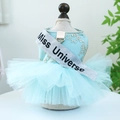 Detail of light blue pet gown with lace patterns and a glitter Miss Universe sash - Miss Universe Dress - Blue And Green